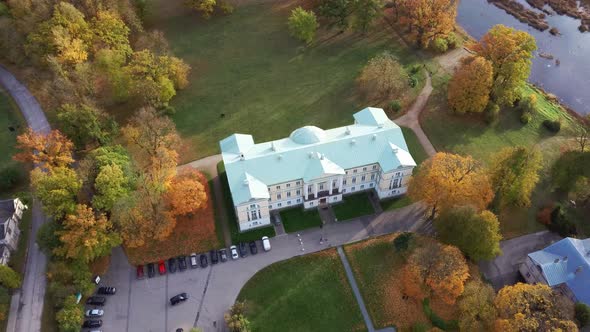 Autumn Aerial Landscape of the City Mezotne and Palace With Park Near Lielupe River, Latvia 4K Video alt