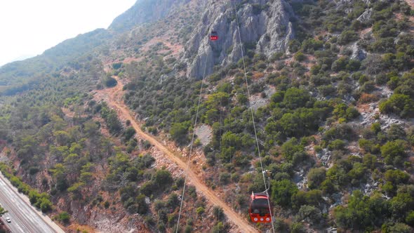 Close-up Flight Next To the Uphill Funicular with the Coast in the Background  alt