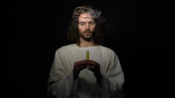 Jesus in Crown of Thorns Holding Smoking Candle, Disappearing in Darkness, Death alt