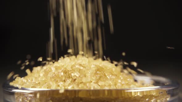 Slow Motion Brown Sugar Pour in a Bowl Close Up