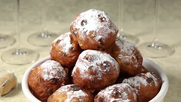  Plate with traditional Dutch oliebollen, deep-fried raisin bun, close up alt