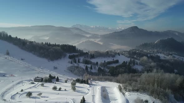 Aerial drone view of beautiful winter mountain scenery. Winter wonderland cover with snow. 