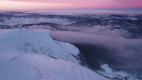 Aerial Drone Perspective of Big Mountain Valley at Sunset Golden Hour