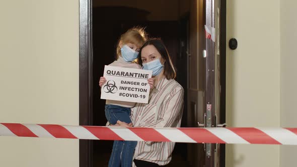 Sick Young Family of Woman with Child Daughter Stay at Home During Coronavirus Quarantine Lockdown alt