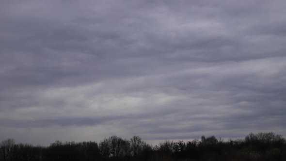 Time lapse: tense clouds flying in the sky blown by light wind