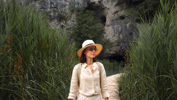 Attractive girl walking in a national park in Croatia alt