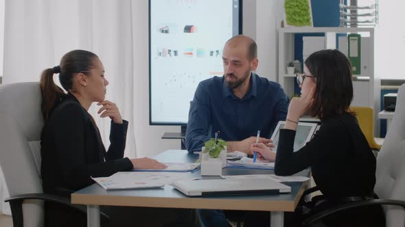 Workmates Talking About Marketing Strategy for Business alt