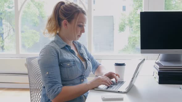 Businesswoman working on laptop 4k alt