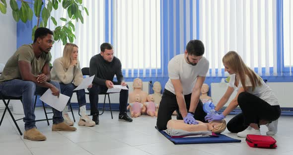 Male Instructor Teaching First Aid Cpr Technique to His Students alt