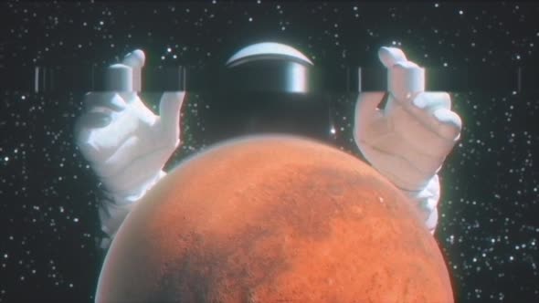 An Astronaut Stretches His Hands Behind the Planet Mars alt
