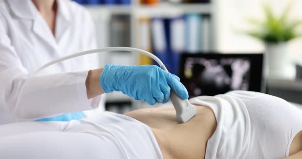 The Doctor Makes an Ultrasound Abdominal Cavity Slow Motion alt