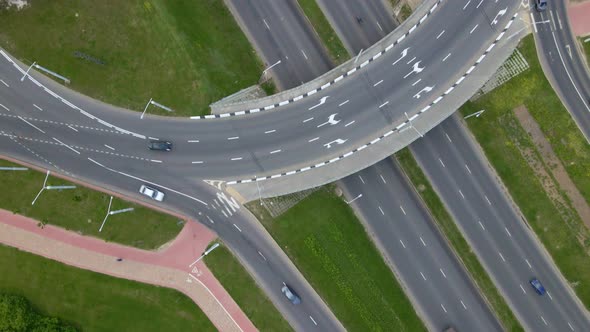 Multilevel Road Junction. Flight Over City Roads. Public Transport Is Visible. alt