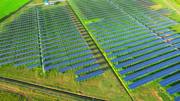 Drone fly over solar farm, renewable energy from solar. alt