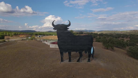 Aerial View of a Rodeo Arena Near Toledo with a Big Sign in Shape of a Bull alt