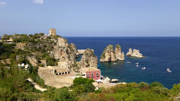 Spectacular panoramic view of Stacks or Faraglioni of Scopello and Torre Doria tower in Sicily. Ital alt