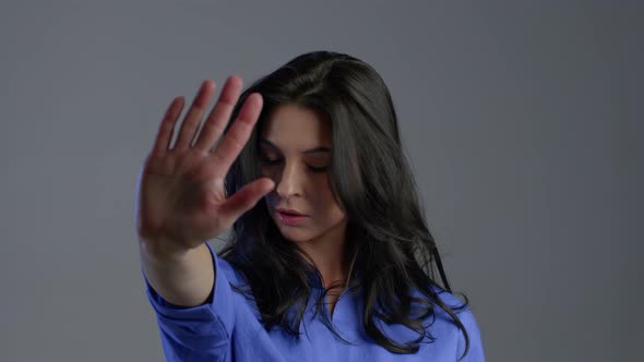 Mature Woman Disapproving with NO Hand Sign Gesture. Denying,rejecting, Disagree alt