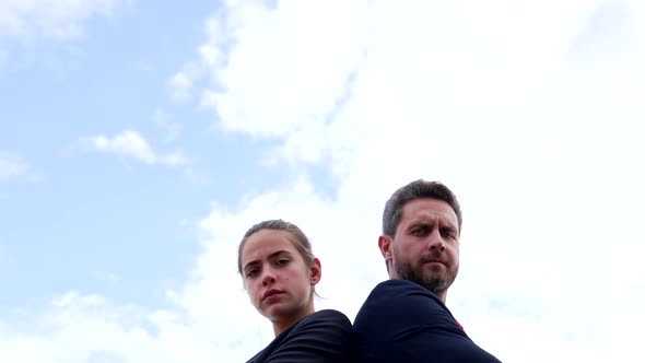 Professional Couple of Serious Man and Frown Woman Stand Keeping Arms Crossed on Sky Colleagues alt