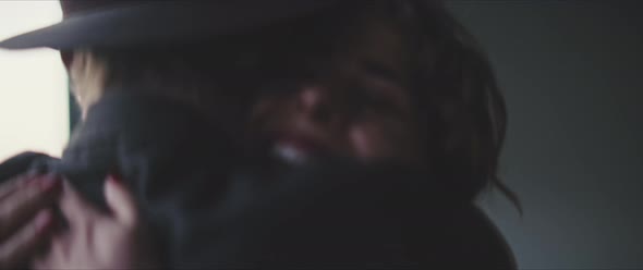 A woman filmed by her boyfriend stops him and hugs him alt