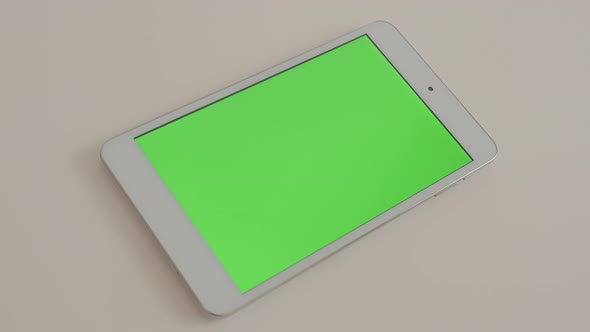 Silver PC tablet with green screen  slow panning 4K 3840X2160 UHD video - Greenscreen display tablet alt
