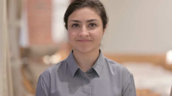 Portrait of Young Indian Woman Shaking Head as No Sign alt