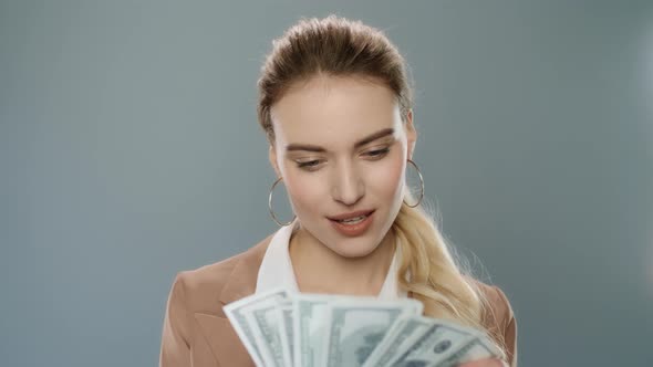 Happy Business Woman Throwing Money Cash in Slow Motion. Rich Businesswoman alt