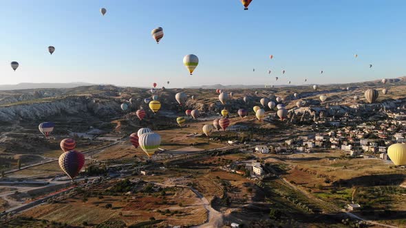 Aerial Hot Air Balloons Flying Over Hoodoos and Fairy Chimneys in Goreme Valley Cappadocia, Turkey alt