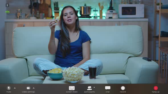 Lady Talking on Camera Sitting on Couch alt