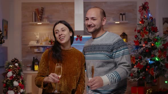 Festive Man and Woman Using Video Call Conference alt