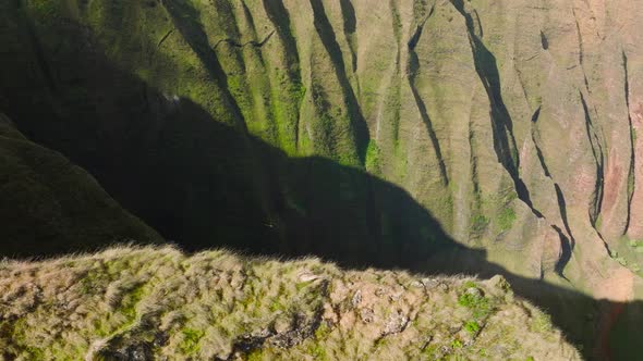 Kauai National Park Aerial Small Helicopter Flying in Deep Green Mountain Canyon alt