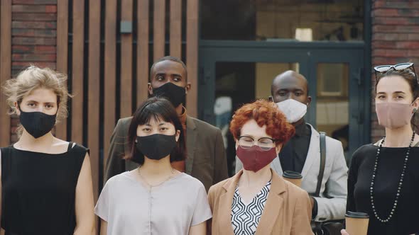 Portrait of Diverse Business Team in Masks Outdoors alt