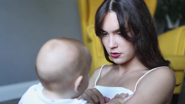 Strict Upset Mother Talking Infant Baby Pointing Finger Explaining Prohibited alt