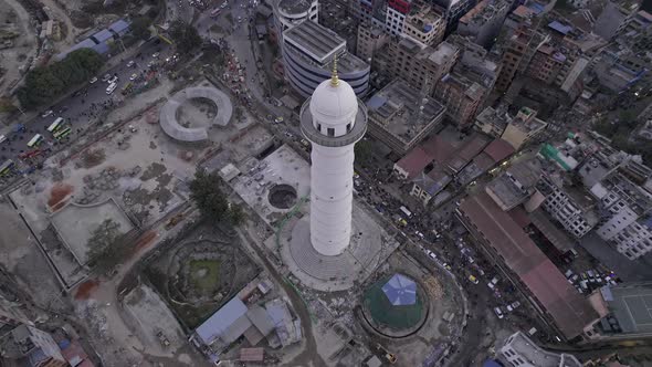 Flying up and over the Dharahara Tower looking down at it alt
