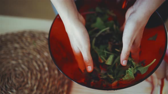 Woman preparing vegetable salad alt