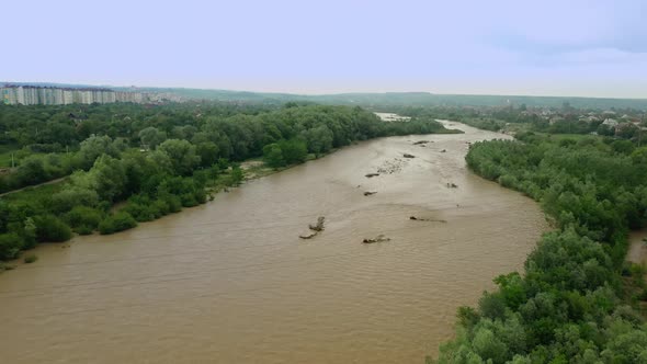 Aerial Drone View. Rriver Water Big and Dirty After Heavy Rain. Slow Motion. Wide View alt