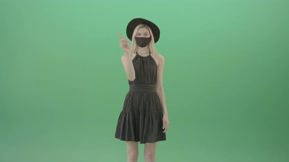 Beauty Blonde Luxury Girl In Covid 19 Mask Looking For Virtual Products In E Commerce Touch Screen alt