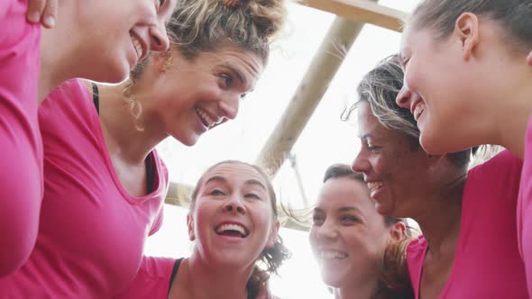 Female friends enjoying exercising at boot camp together alt