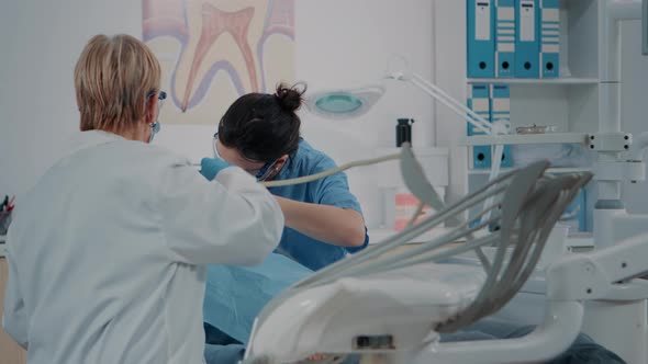 Team of Specialists Consulting Patient with Toothache alt