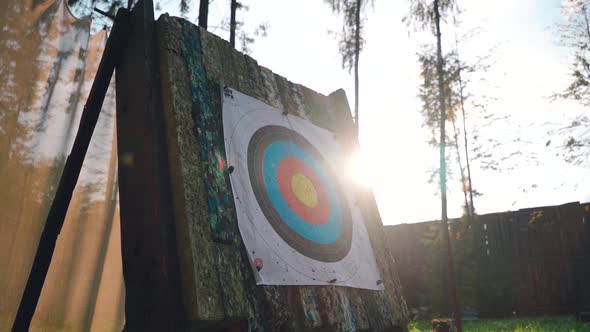 Nicw Cinematic View of Target for Archery with Sun on the Background and Bow Arrow Hit the Target in alt