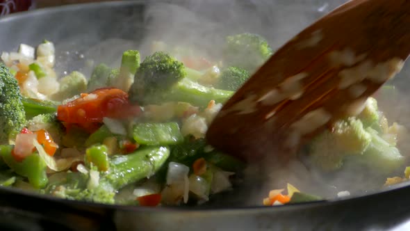 Lunch of Vegetables. Cook the Vegetable Stew in a Pan. Frozen Vegetables on a Salad. Semi-finished