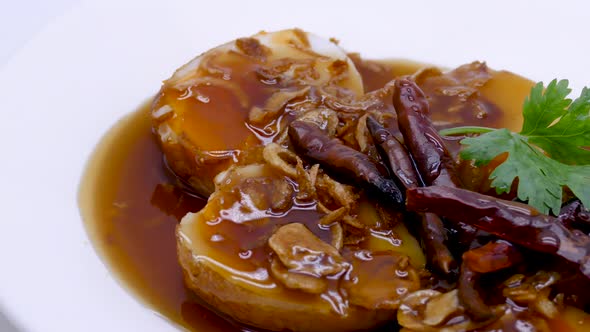 Close-up Footage of Son In Law Egg (Kai Look Kuey), Deep Fried Egg with Sweet and Sour Tamarind Sauc alt