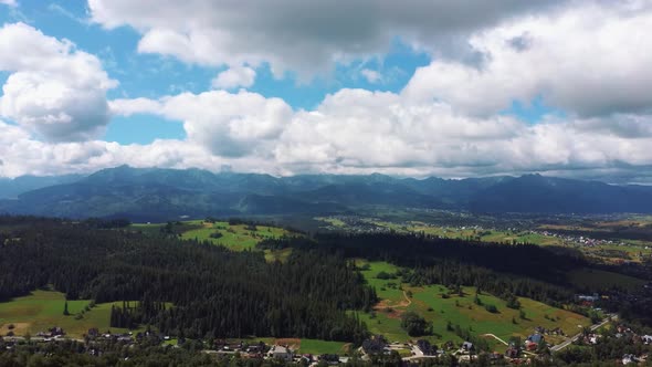 Flight Over a Mountain Cottage Village in Poland, Zakopany, Tatra National Park Aerial 4K Video alt