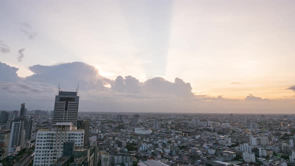 Time lapse of cloudement over Bangkok cityscape during golden hour alt