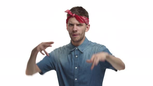 Video of Handsome Hipster Guy with Red Headband Over Forehead Make Hiphop Gestures and Rapping