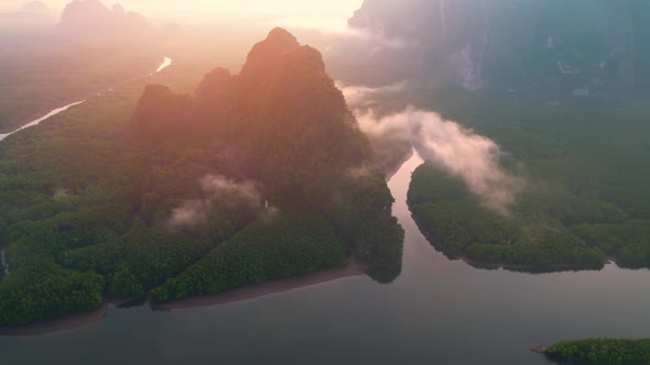 4K : Drone flying above the clouds, Limestone mountains with mangrove alt