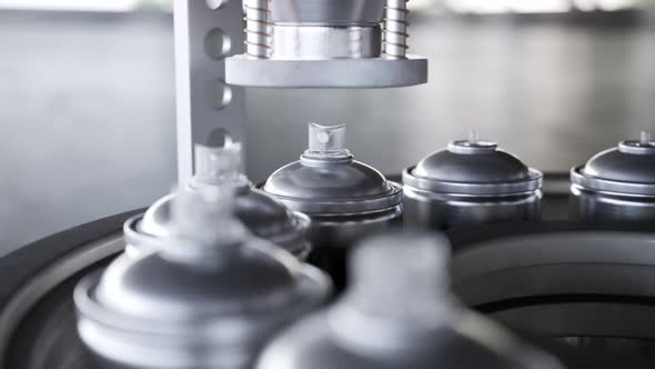 Countless aluminium spray cans on a pipeline being assembled in the factory  4K alt