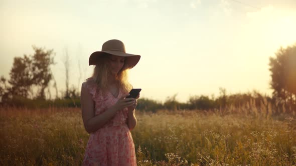 Woman Chatting Texting In Internet Social Network. Beautiful Woman Using Smartphone Outdoors. alt