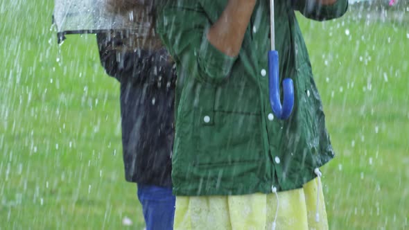 Girl Jumping and Laughing in Rain alt