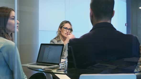 Entrepreneurs in meeting negotiating business alt