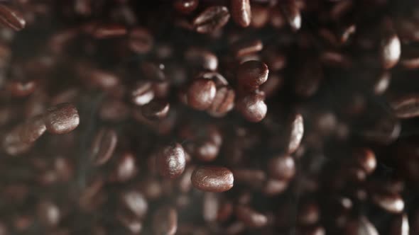 Super Slow Motion Shot of Exploding Premium Coffee Beans Towards the Camera at 1000Fps. alt