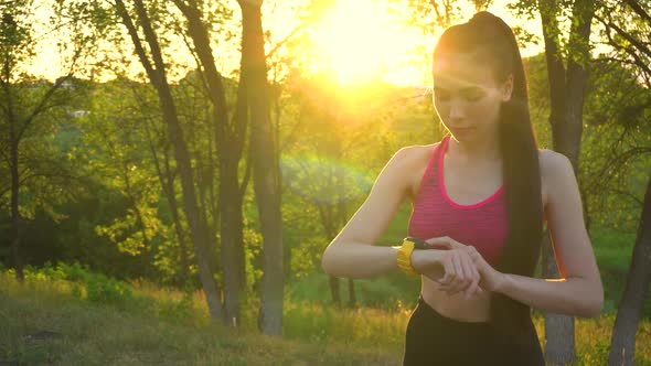 Woman Checking Fitness and Health Tracking Wearable Device